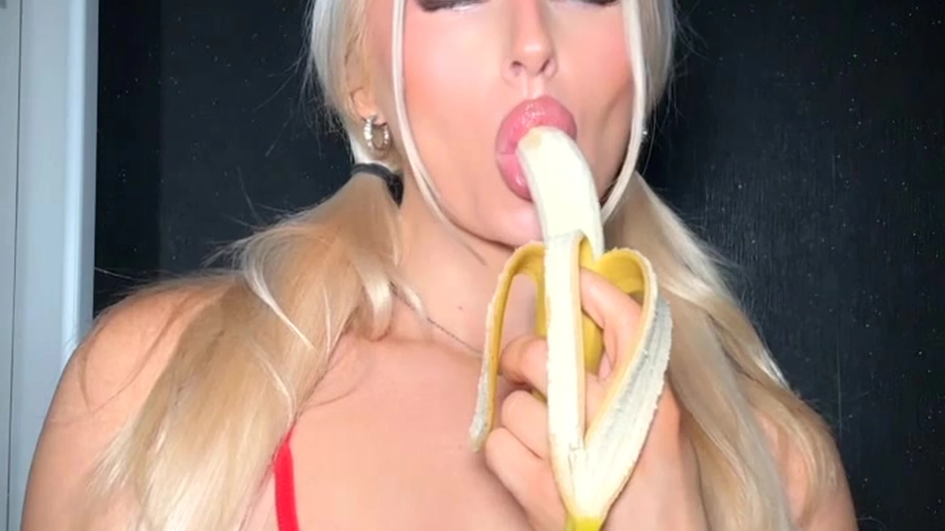 Charlotte Parkes licking and sucking a banana