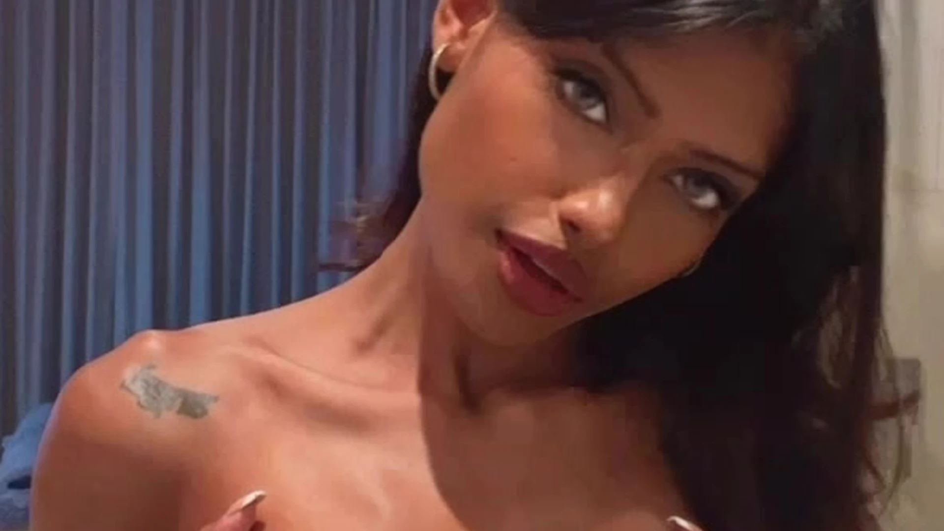 Anna Celeste squeezing and pressing her own boobs